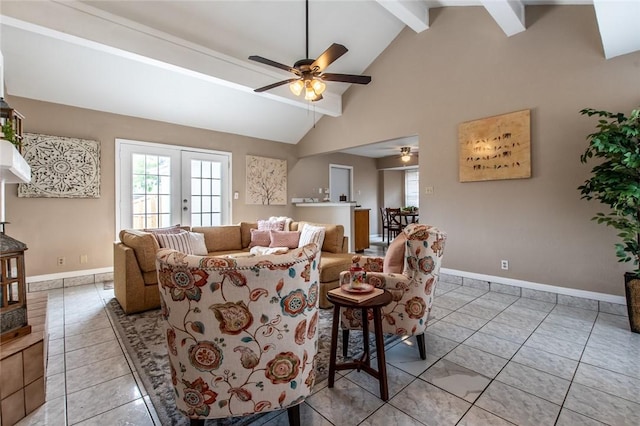 living area featuring vaulted ceiling with beams, a ceiling fan, baseboards, and light tile patterned floors