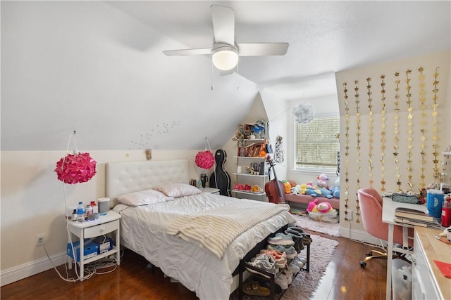 bedroom with vaulted ceiling, a ceiling fan, baseboards, and wood finished floors