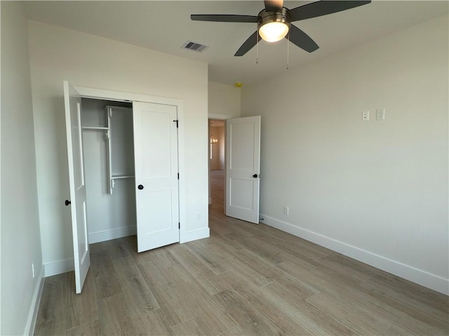 unfurnished bedroom with a ceiling fan, baseboards, visible vents, a closet, and light wood-type flooring