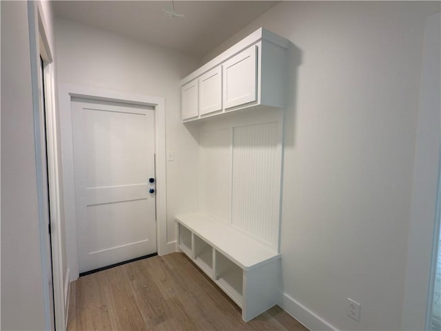 mudroom with wood finished floors