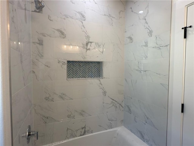 bathroom with shower / tub combination