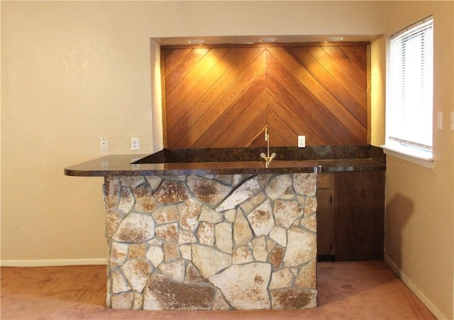 bar with light colored carpet and baseboards