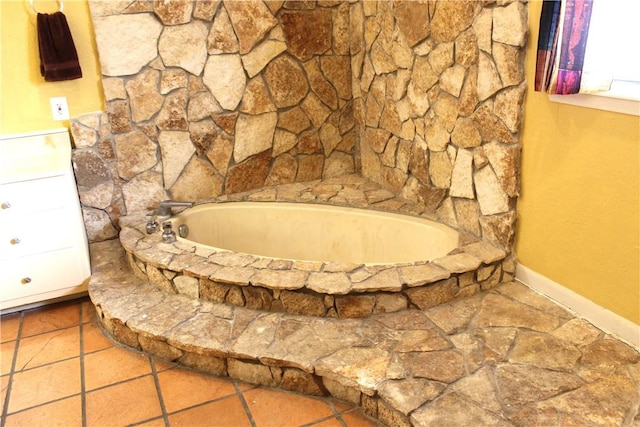 full bath with tile patterned flooring and a bath