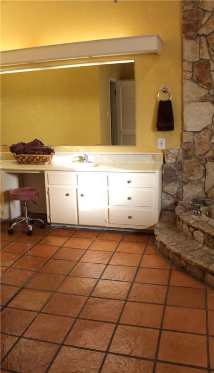 bathroom featuring tile patterned flooring and a sink