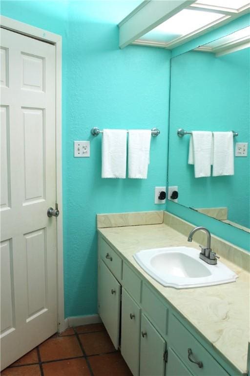 bathroom with tile patterned flooring and vanity