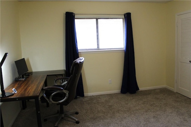 unfurnished office with carpet and baseboards