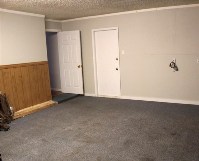 garage featuring wainscoting and wooden walls