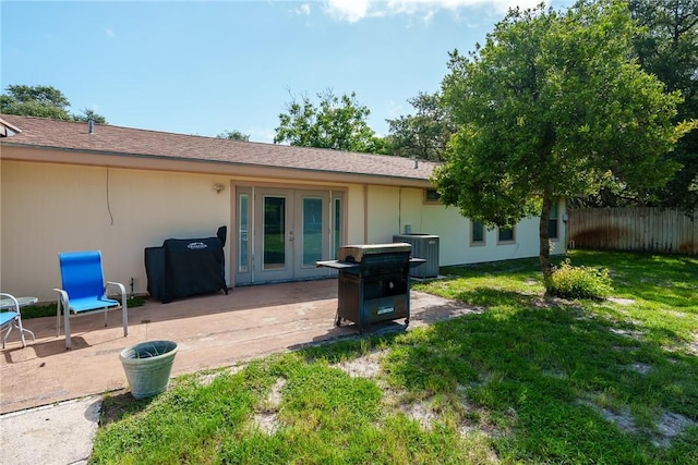 1689 Mooney Ln, Ingleside, TX 78362 - rear view of property with french doors, a patio, and stucco siding