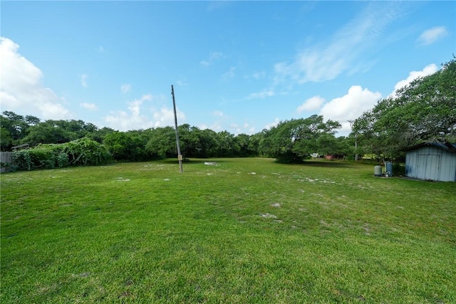 1689 Mooney Ln, Ingleside, TX 78362 - view of green lawn with a shed