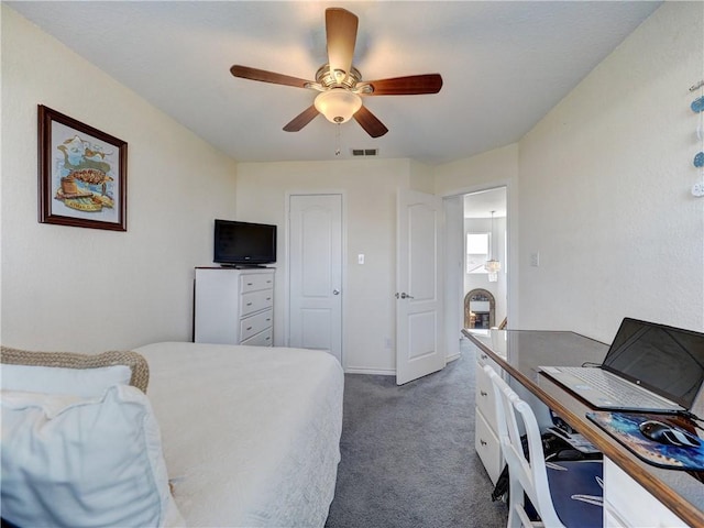 carpeted bedroom with a ceiling fan, visible vents, and baseboards