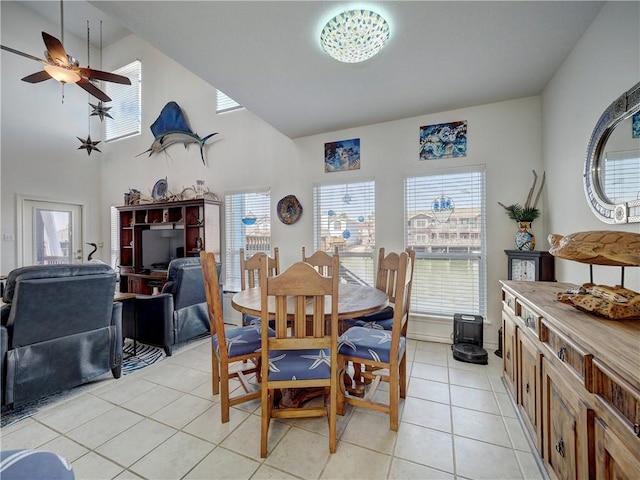 dining room with light tile patterned floors, a ceiling fan, and a wealth of natural light