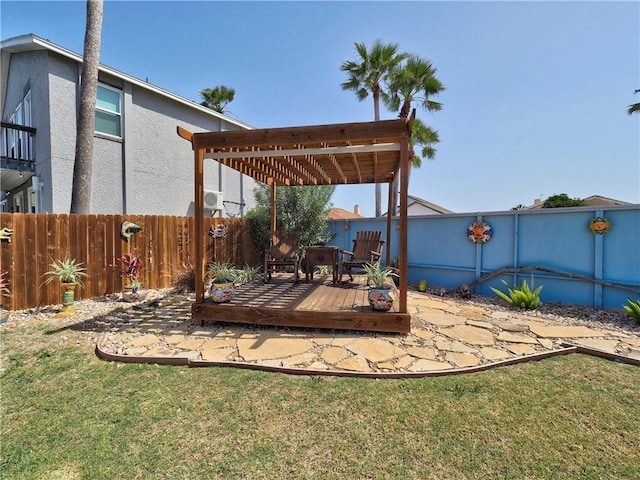 wooden deck featuring fence and a yard