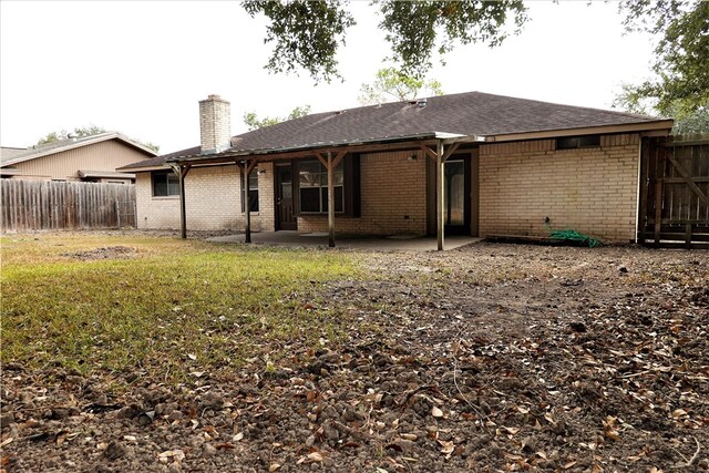 back of property featuring a patio