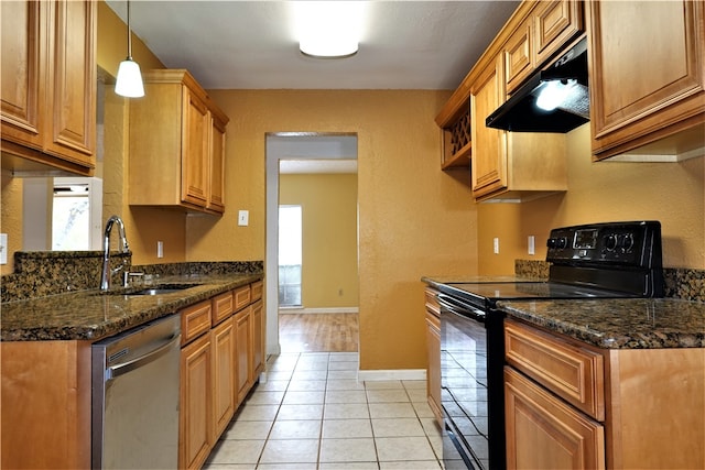 kitchen featuring dishwasher, black electric range oven, dark stone counters, extractor fan, and light tile patterned flooring