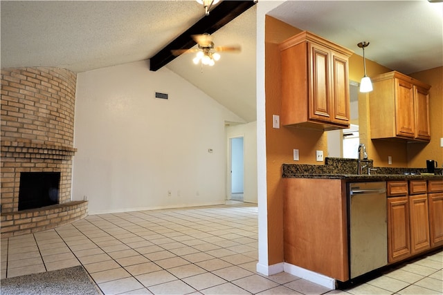 kitchen featuring ceiling fan, light tile patterned floors, lofted ceiling with beams, pendant lighting, and a fireplace