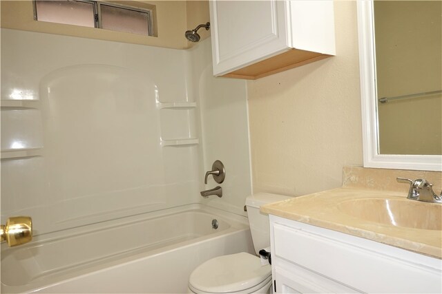 full bathroom featuring washtub / shower combination, vanity, and toilet