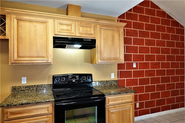 kitchen featuring black electric range oven, dark stone countertops, light tile patterned flooring, and vaulted ceiling