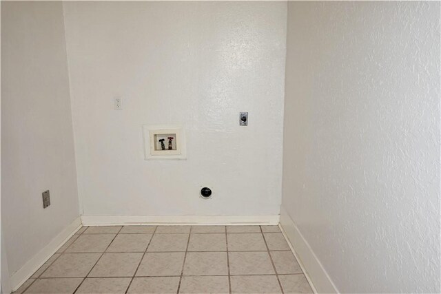 laundry room with washer hookup, light tile patterned floors, and electric dryer hookup