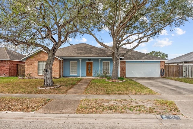 ranch-style home with a garage and a front lawn