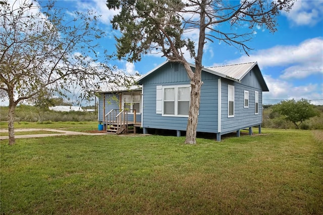 back of house with a yard