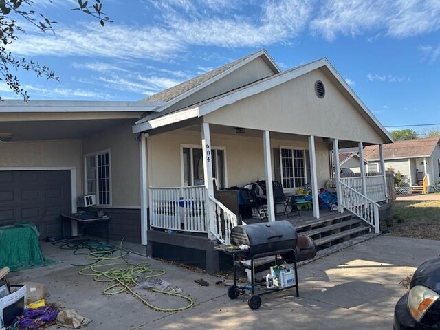 604 N Ironwood Ave, Bishop, TX 78343 - view of front of house with covered porch and stucco siding