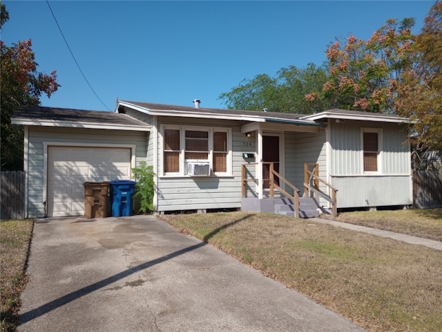 single story home featuring a front lawn and a garage