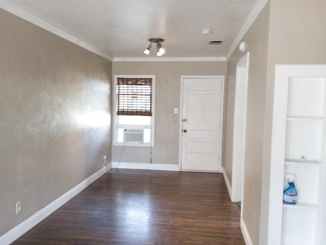 entrance foyer with ornamental molding, cooling unit, and dark hardwood / wood-style floors