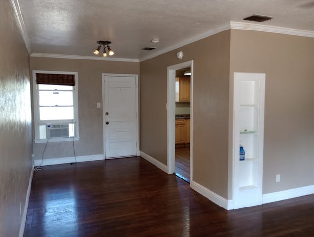 entryway with ornamental molding, dark wood-type flooring, and cooling unit