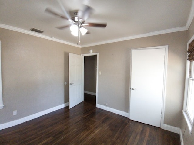 unfurnished bedroom featuring dark wood-type flooring, ceiling fan, and crown molding