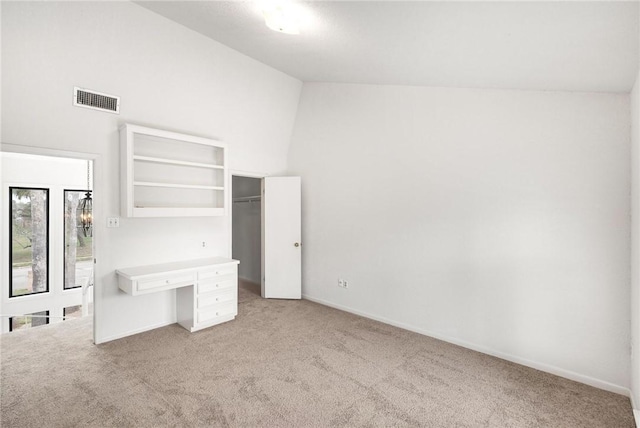 6002 Parkland Dr, Corpus Christi, TX 78413 - unfurnished bedroom featuring a closet, high vaulted ceiling, and light carpet