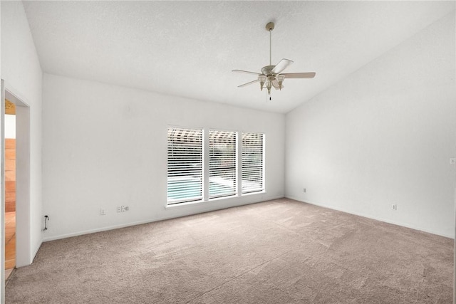 6002 Parkland Dr, Corpus Christi, TX 78413 - empty room with light carpet, a textured ceiling, vaulted ceiling, and ceiling fan