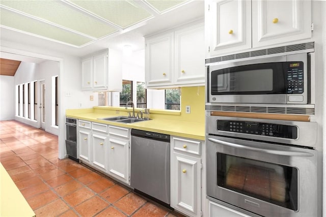 6002 Parkland Dr, Corpus Christi, TX 78413 - kitchen featuring white cabinetry, appliances with stainless steel finishes, and sink