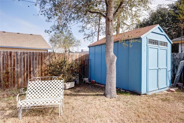 view of outbuilding with a yard