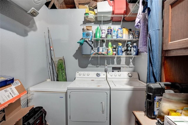 clothes washing area with washer and dryer