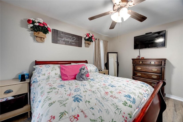 bedroom featuring ceiling fan and hardwood / wood-style floors