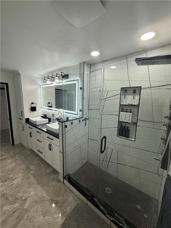 bathroom featuring vanity and a shower with door