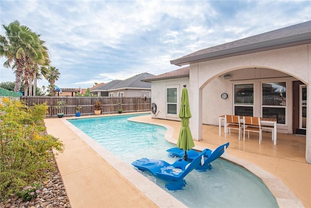 view of pool featuring a patio area, a fenced backyard, and a fenced in pool