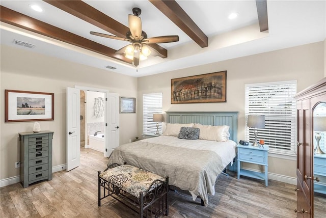 bedroom with baseboards, beamed ceiling, visible vents, and light wood-style floors