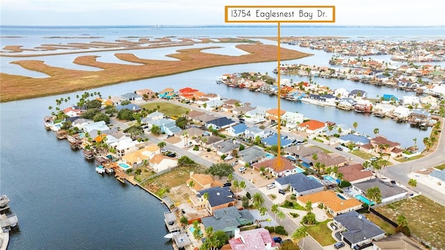 aerial view with a water view and a residential view