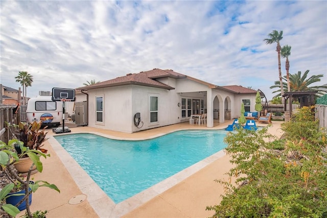 view of swimming pool with fence private yard, a fenced in pool, and a patio