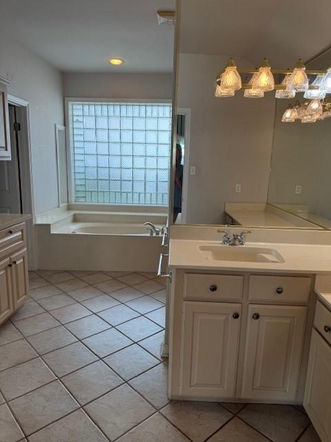 718 Broadway Blvd, Portland, TX 78374 - bathroom with tile patterned flooring, a bath, and vanity