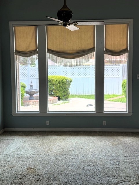 718 Broadway Blvd, Portland, TX 78374 - carpeted empty room with plenty of natural light, baseboards, and ceiling fan