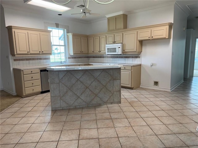 718 Broadway Blvd, Portland, TX 78374 - kitchen featuring white microwave, dishwasher, ceiling fan, decorative backsplash, and crown molding