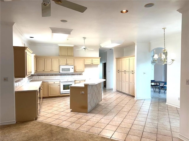 718 Broadway Blvd, Portland, TX 78374 - kitchen with white appliances, a ceiling fan, a kitchen island, tasteful backsplash, and light countertops