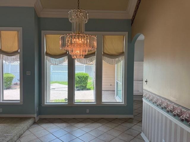 718 Broadway Blvd, Portland, TX 78374 - unfurnished dining area featuring a chandelier, ornamental molding, light tile patterned flooring, baseboards, and arched walkways