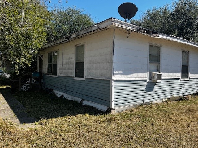 view of home's exterior with a yard