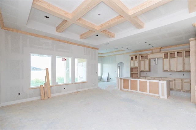 kitchen featuring beam ceiling, a kitchen island, and coffered ceiling