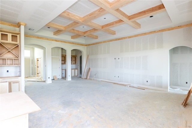 unfurnished living room featuring beamed ceiling and coffered ceiling