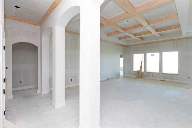 unfurnished room featuring ornamental molding, beam ceiling, and coffered ceiling