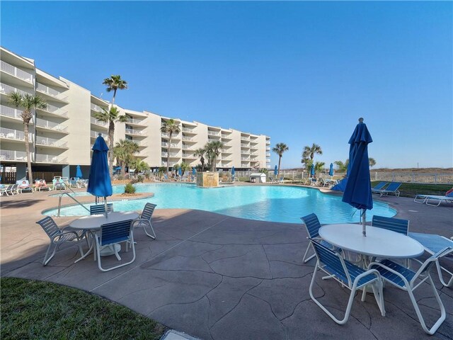 800 Sandcastle Dr Unit 215, Port Aransas, TX 78373 - pool featuring a patio area
